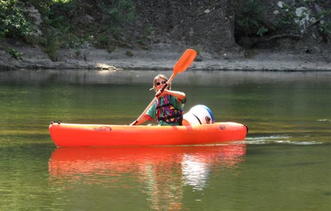 Sara in Kayak reflected in River Orb, Languedoc